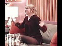 Taylor Swift bouncing on sofa