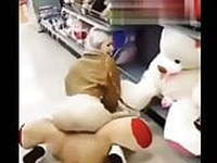 Playing with a Teddy Bear in a store