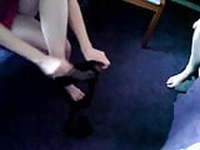 Wife putting on black pantyhose