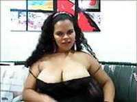 Busty Latina teases with big tits and pussy on cam