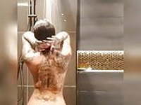 Tattood beuty showering