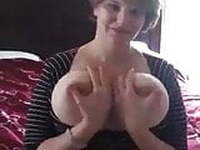 Guy films his girlfriend fondling her huge udders