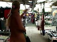 Girl strips naked in an outdoor mall to try on some clothes