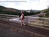 Nude on a bridge